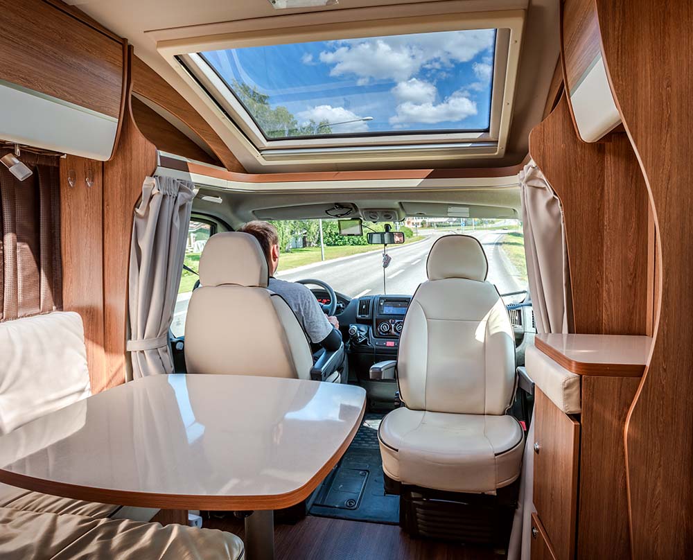 Man driving on a road in the Camper Van RV RV Inspection Services